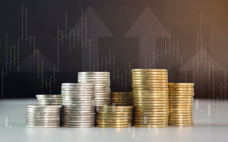 Stack of coins for finance and banking concept, coin stack with graph chart for business idea.の写真素材