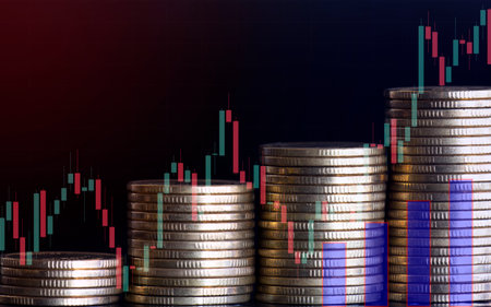 Double exposure of coin stack with stock market graph and candle stick, business and finance concept idea.の写真素材