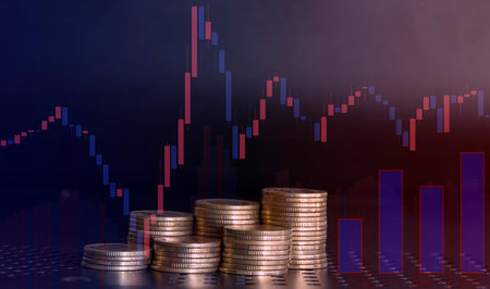 Coins stacked on each other on the background of the rising graph.の写真素材