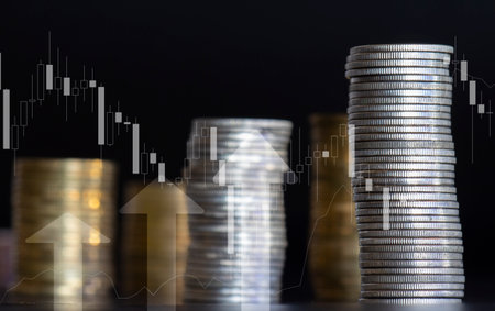 Double exposure of coin stack and graph stock market or forex trading and investment concept idea.の写真素材