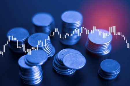 Investment concept, Coins graph stock market financial on LED background.の写真素材