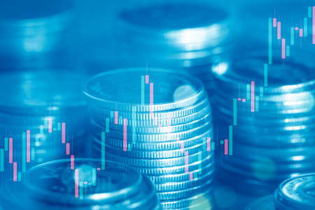 Double exposure of coin stack and stock market or forex trading graph and candlestick chart suitable for financial investment concept.の写真素材