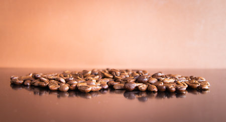 Coffee beans on brown background with copy space for text.の写真素材