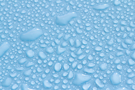Water drops on blue background, close up. Water drops on blue backgroundの写真素材