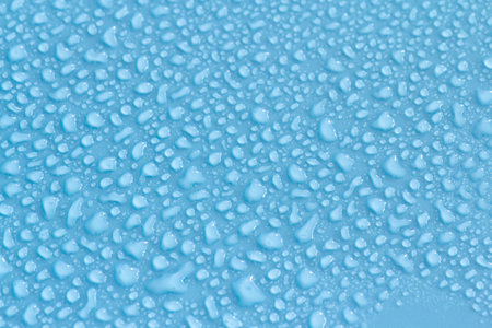 Water drops on blue background. Water drops on a blue background.の写真素材