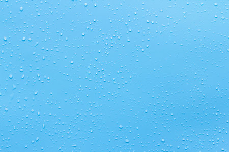 Water drops on blue background. Water drops on blue background. Water drops on blue backgroundの写真素材