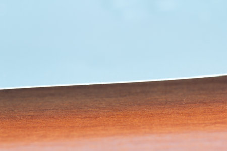 Close up of a wooden table with a shallow depth of field.の写真素材