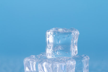 Ice cube on a blue background. Close-up. Macro.の写真素材