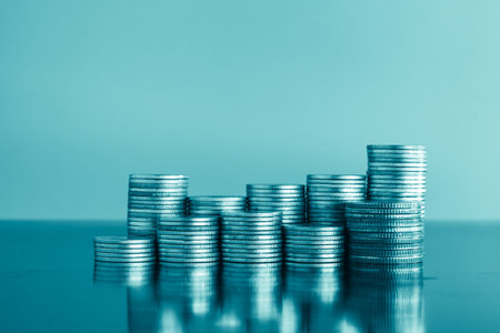 Stacks of coins with blue background, business finance and banking concept idea.の写真素材