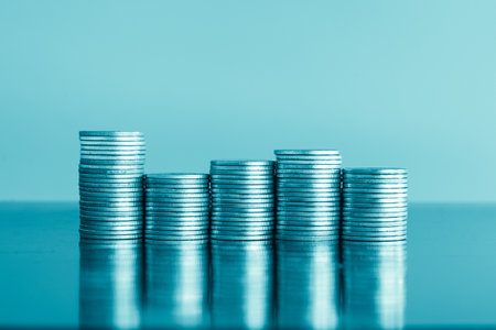 Stacks of coins on blue background, business and finance concept idea.の写真素材