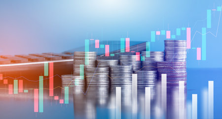 Double exposure of coin stack with stock market graph background, business and financial concept idea.の写真素材