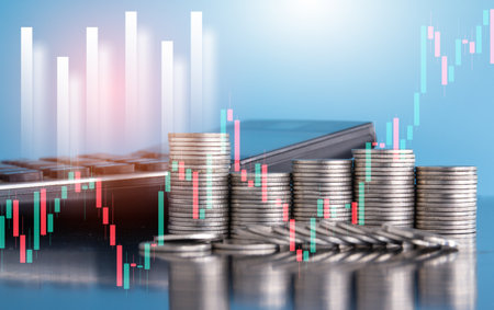 Double exposure of coin stack with stock market graph, business and finance concept idea.の写真素材
