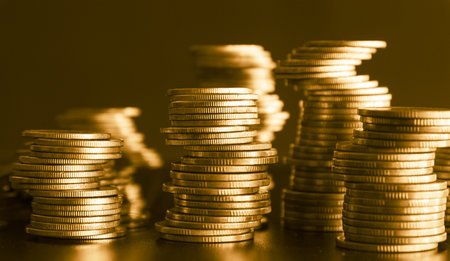 Stacks of gold coins, finance and banking concept, shallow depth of fieldの写真素材