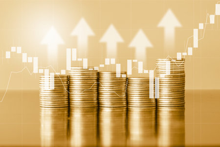 Double exposure of coin stack with financial graph, business and financial concept idea.の写真素材