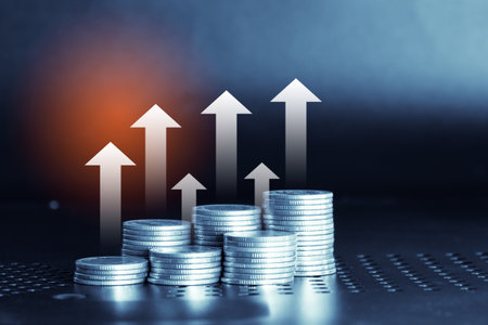 Stacks of coins with growth graph, business and finance concept idea.の写真素材