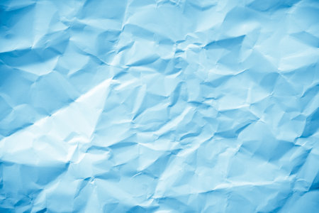 Blue crumpled paper background. Crumpled paper texture.の写真素材