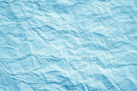 Blue crumpled paper background. Crumpled paper texture.の写真素材