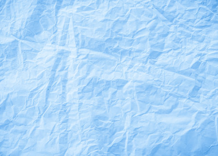 Blue crumpled paper texture background. Crumpled paper background.の写真素材