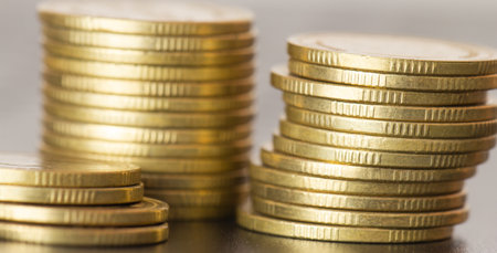 Close up of golden coins on the table. Business and finance concept.の写真素材