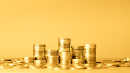 Coins stacks on yellow background, business and finance concept idea.の写真素材