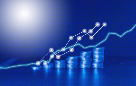 Investment concept, Coins graph stock market financial on blue background.の写真素材