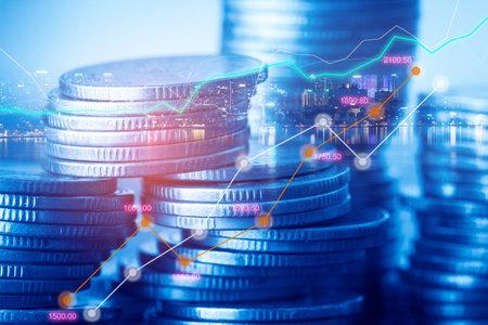 Double exposure of coin stack with city and finance graph, business and financial concept idea.の写真素材