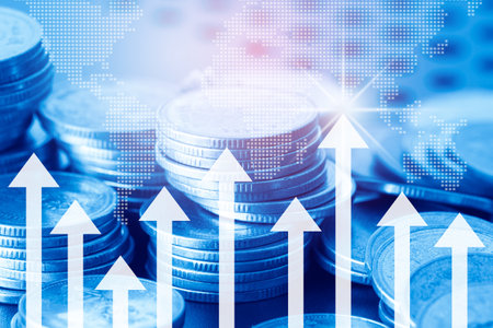Double exposure of coin stack with financial graph and world map background, business and finance concept idea.の写真素材