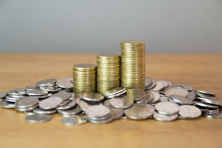 Coins stacked on each other in different positions. Financial concept.の写真素材