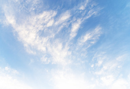 Blue sky background with white clouds. Cumulus white clouds in the clear blue sky.の写真素材