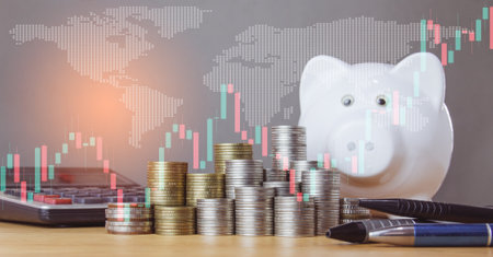 Piggy bank with coins and calculator for finance and banking concept.の写真素材