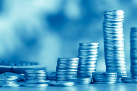 Stacks of coins with blue background, finance and banking concept.の写真素材