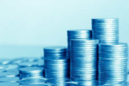 Coins stacked on each other in different positions with shallow depth of fieldの写真素材