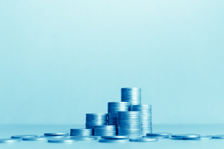 Stacks of coins on blue background, business and finance concept idea.の写真素材