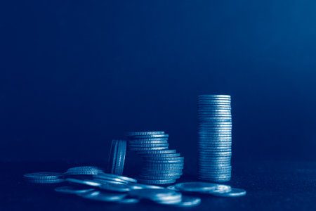 Coins stacked on each other in different positions. Financial and business concept.の写真素材