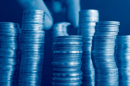 Stacks of silver coins in blue tone, finance and banking concept.の写真素材