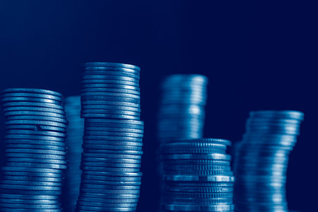 Coins stacks on dark blue background, business banking and finance concept idea.の写真素材