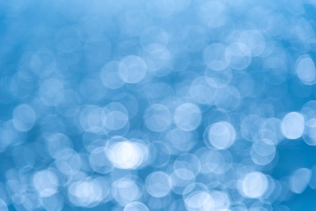 Abstract white bokeh blue backgroundの写真素材