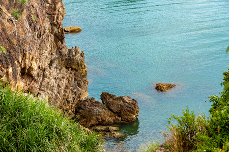 Stone cliff blue sea seascape viewの写真素材