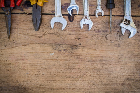 different tools,tools supplies on a wooden background