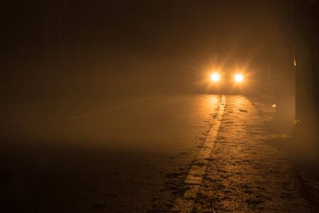 car light and road at nightの写真素材