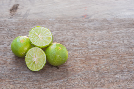 lime slice on wood backgroundの写真素材