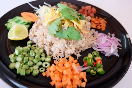 Shrimp fried rice with vegetables, lentils, onions, carrots and peppers.