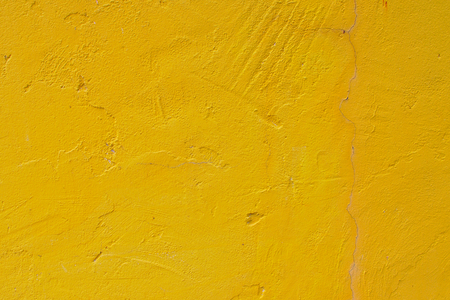 Yellow concrete wall texture and backgroundの写真素材