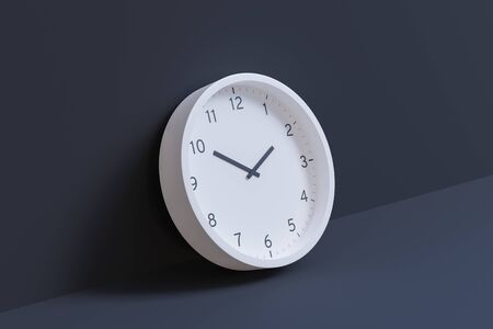 3d rendering - White wall clock leaning against dark gray wall. Hour hand pointing at 2 and minute...