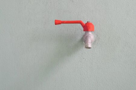 Faucet on cement wallの写真素材