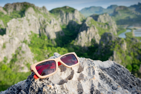 sunglasses on the rock in naturel viewの写真素材