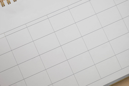 close up empty grid of calender on wood  backgroundの写真素材