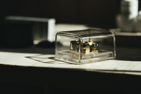 music box placed on wooden table with sunshine pass on them. image for music, gift, toy, retro,...
