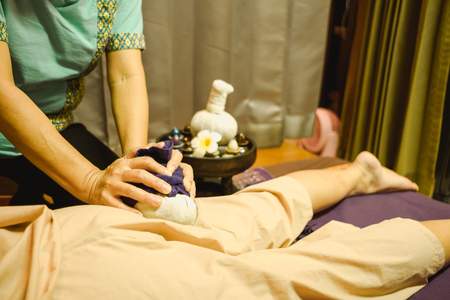 massage background body massage in spa salon young woman expressive relaxation. image for body care, skin care, healthy, lifestyle, person, wellness conceptの写真素材
