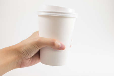  white background hand of bussinessman hold coffee glass with copy space. image for body, food, drink, isolated, cafe, beverage, business conceptの写真素材